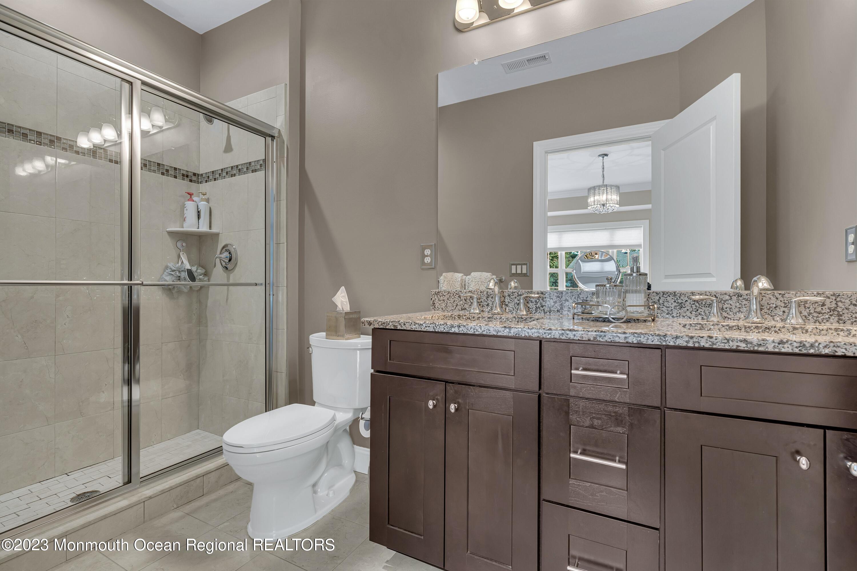 5 Cottrell Court Old Bridge, NJ 08857 - Photo 24 of 49 a bathroom with a granite countertop sink toilet and shower