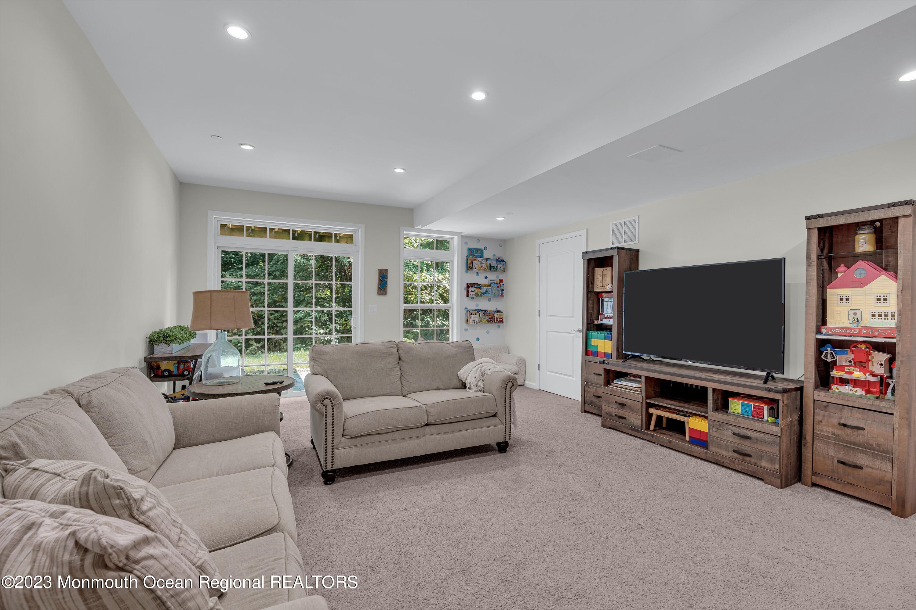5 Cottrell Court Old Bridge, NJ 08857 - Photo 39 of 49 a living room with furniture and a flat screen tv