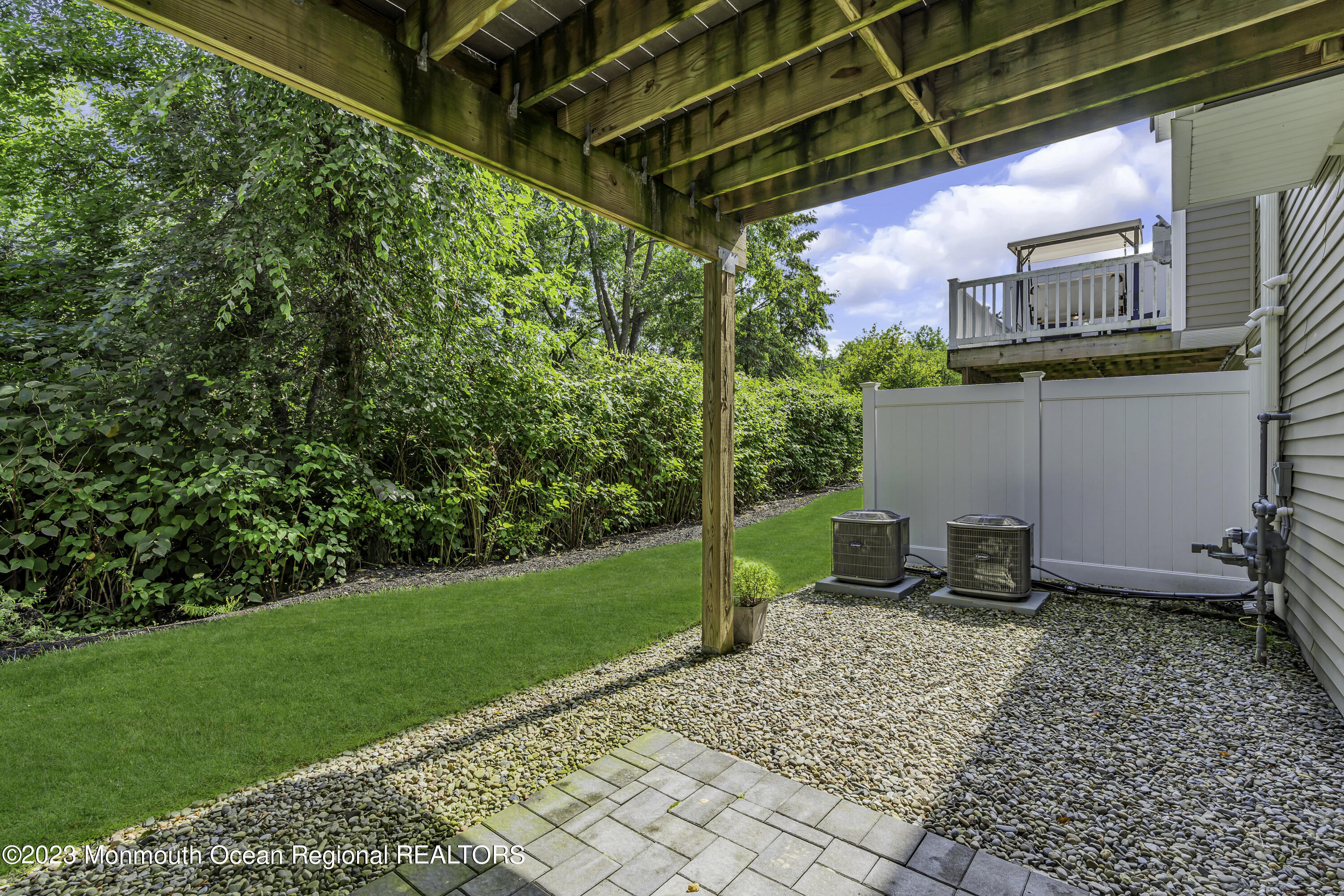 5 Cottrell Court Old Bridge, NJ 08857 - Photo 42 of 49 a backyard of a house with plants and outdoor seating
