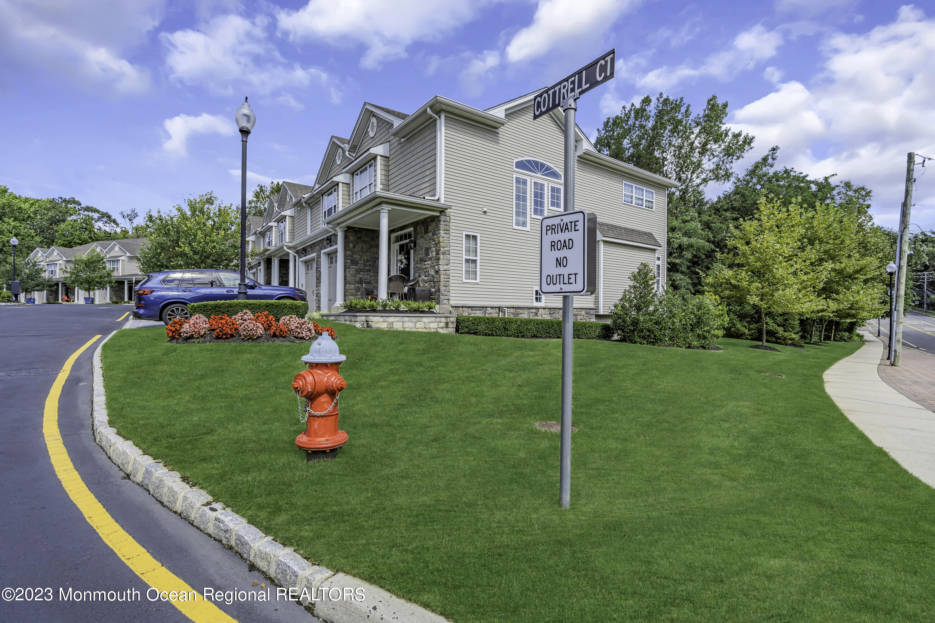 5 Cottrell Court Old Bridge, NJ 08857 - Photo 47 of 49 a front view of a house with a big yard and potted plants