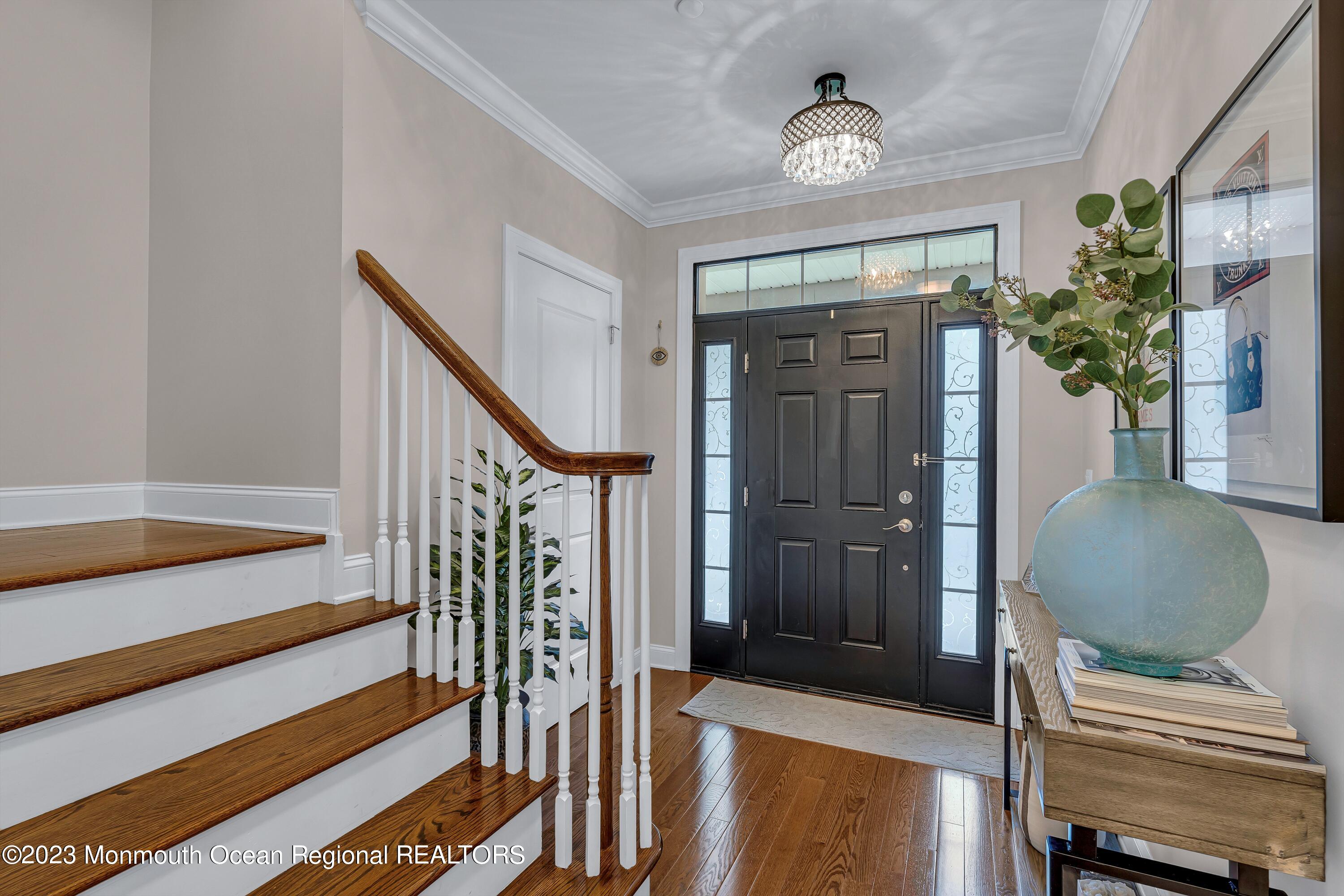5 Cottrell Court Old Bridge, NJ 08857 - Photo 5 of 49 a view of a hallway with wooden floor and staircase