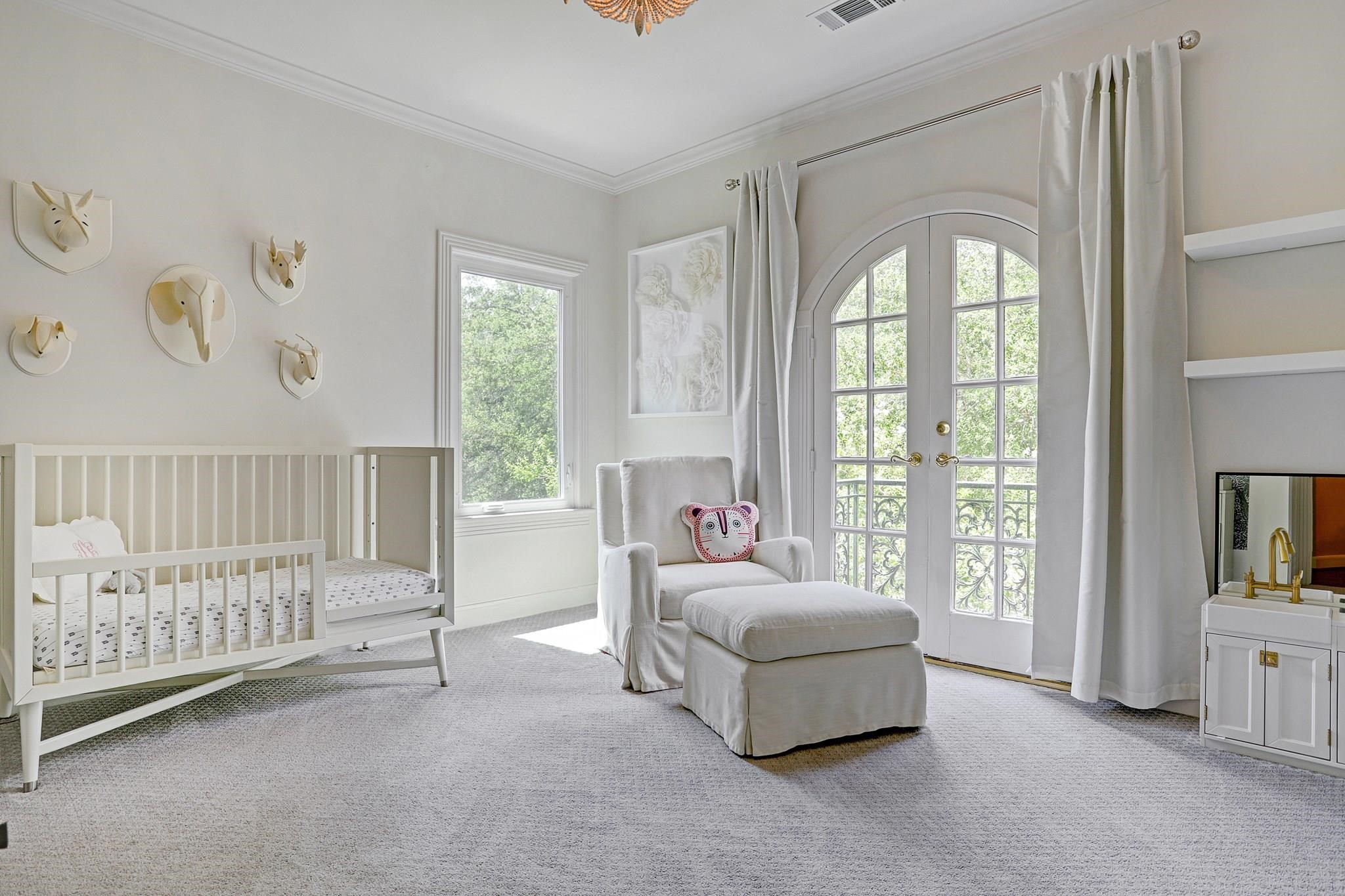 3779 Robinhood Street Houston, TX 77005 - Photo 14 of 17 Sunny secondary bedroom with plush carpet, Juliet balcony.