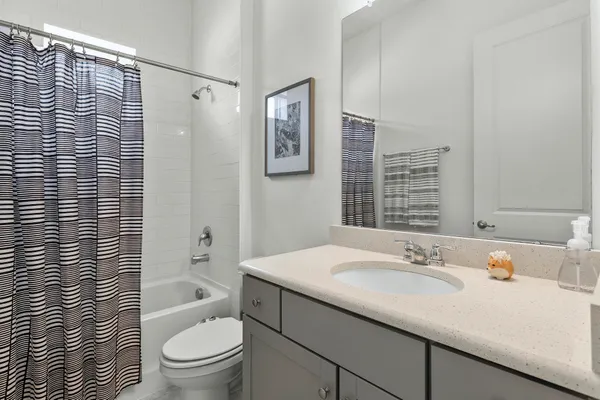 a bathroom with a sink toilet and vanity