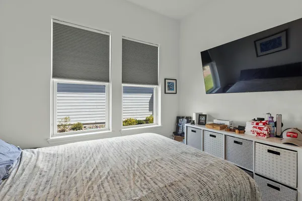 a room with a bed and a flat screen tv
