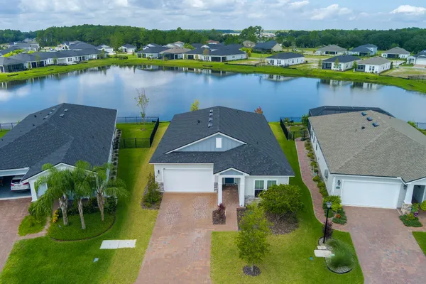 an aerial view of a house with a lake view