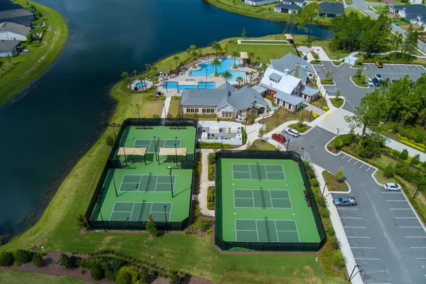 an aerial view of a house with garden space and street view