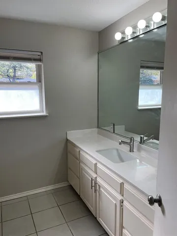 a bathroom with a bath tub with a shower