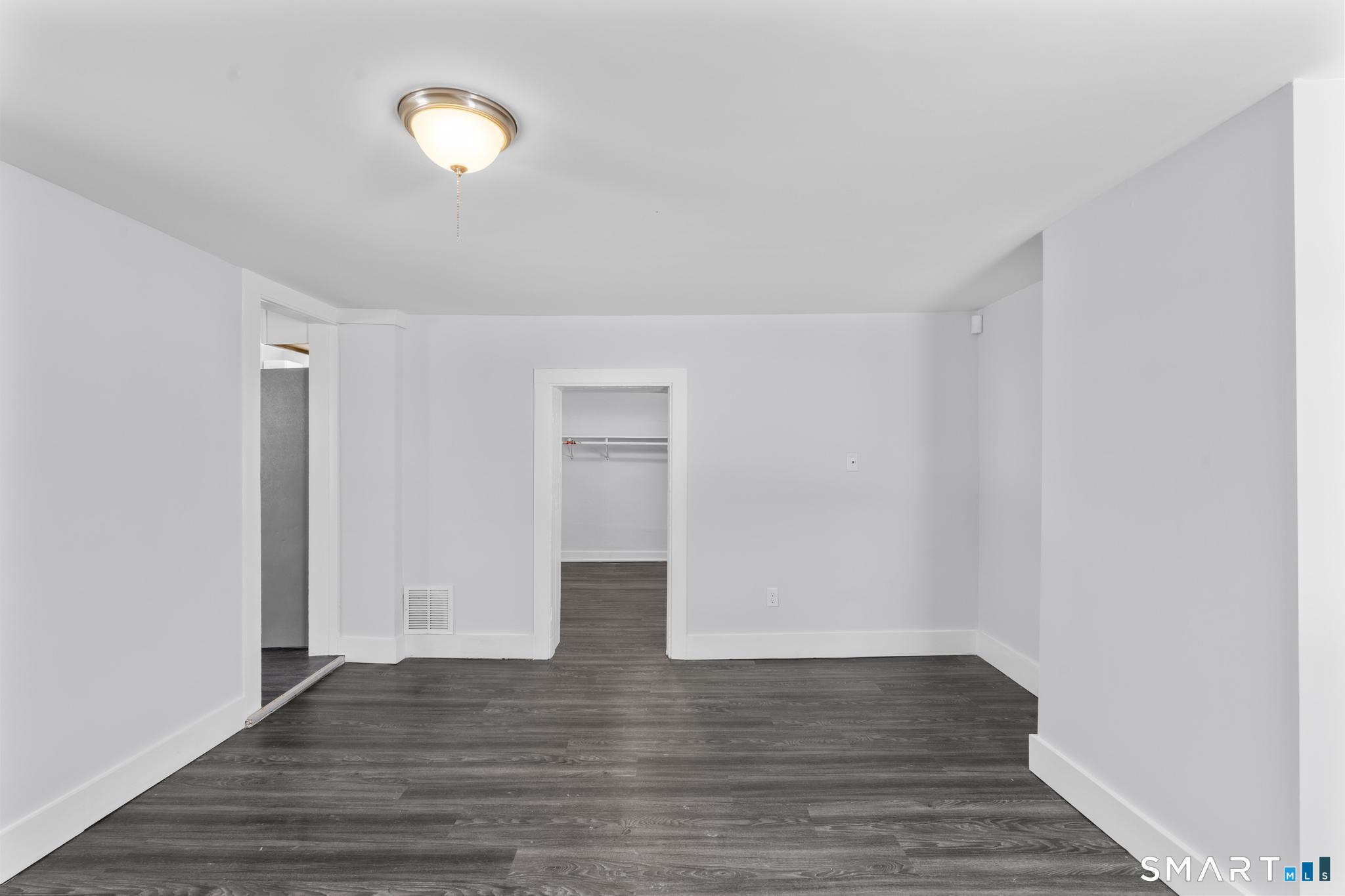 59 Pine Street Hamden, CT 06514 - Photo 14 of 36 a view of empty room with wooden floor