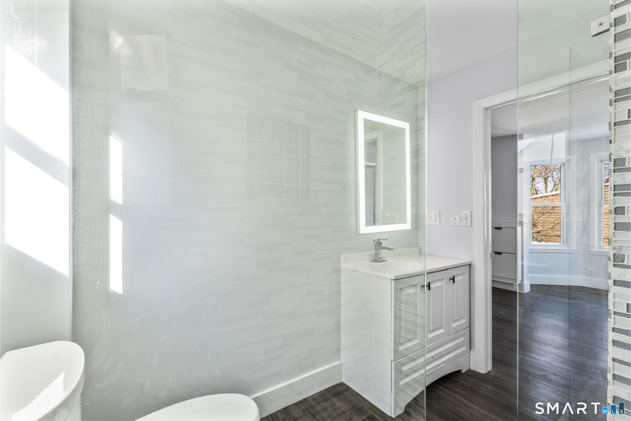 59 Pine Street Hamden, CT 06514 - Photo 17 of 36 a bathroom with a sink and a toilet