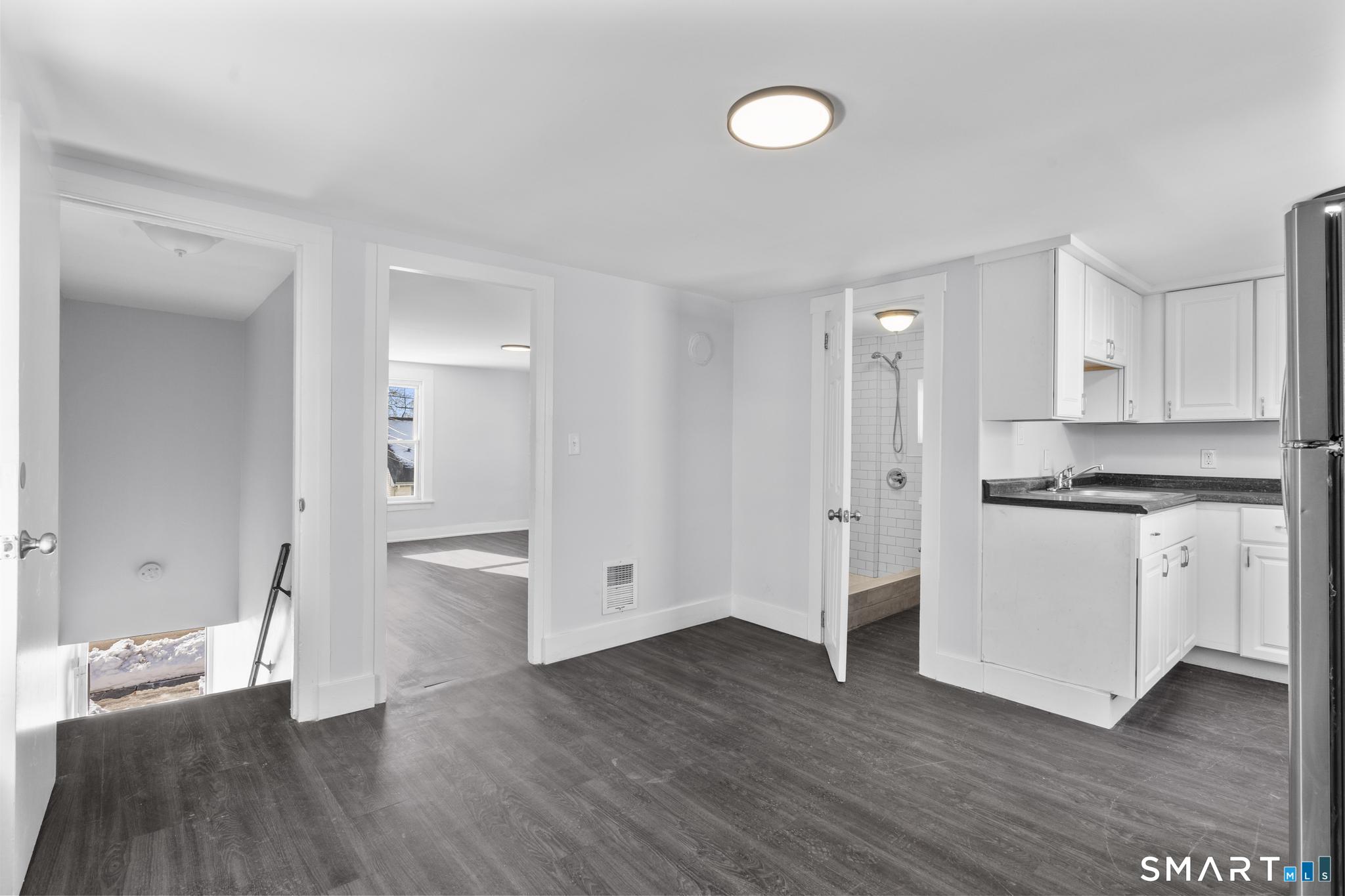 59 Pine Street Hamden, CT 06514 - Photo 19 of 36 a view of kitchen with wooden floor and electronic appliances