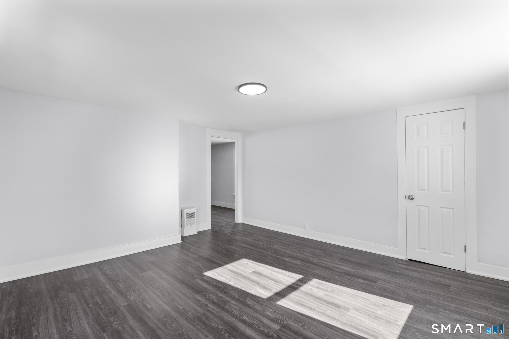 59 Pine Street Hamden, CT 06514 - Photo 25 of 36 a view of wooden floor and windows in a room