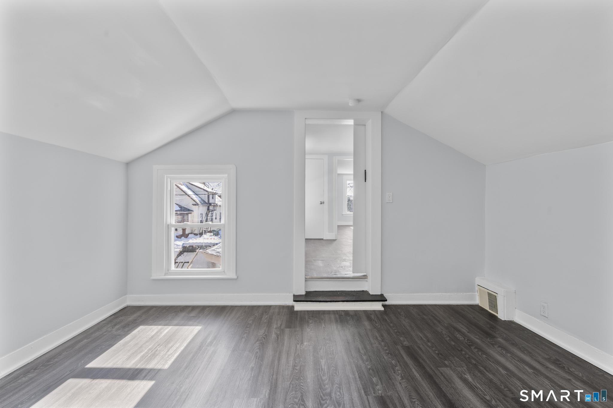 59 Pine Street Hamden, CT 06514 - Photo 31 of 36 an empty room with wooden floor and window