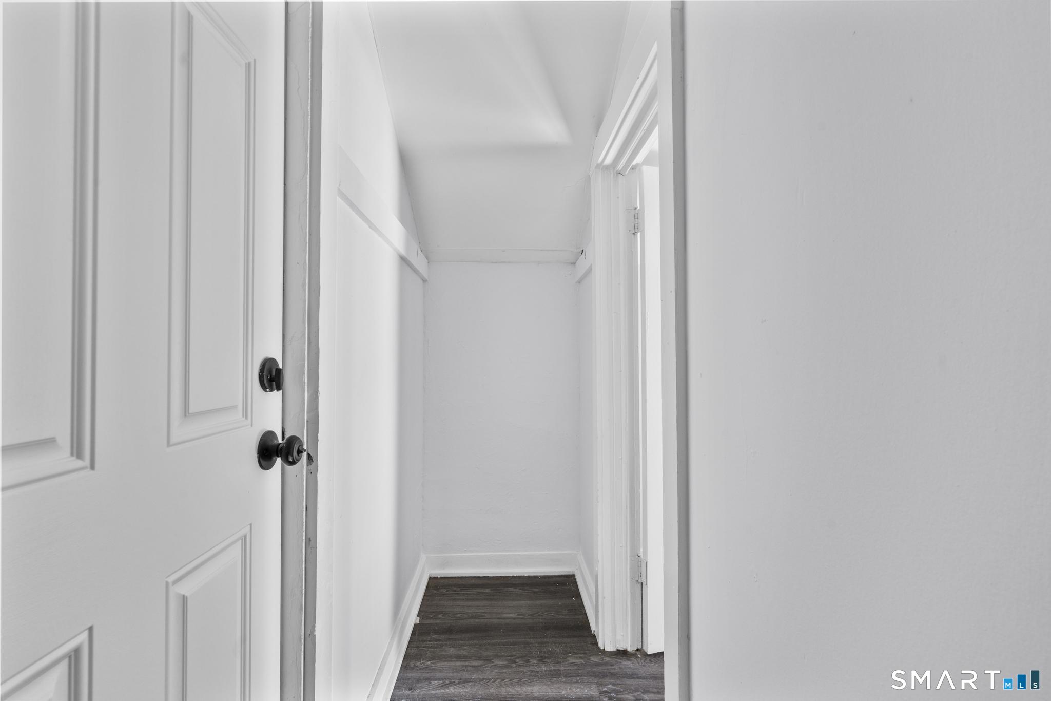 59 Pine Street Hamden, CT 06514 - Photo 33 of 36 a view of a hallway with wooden floor