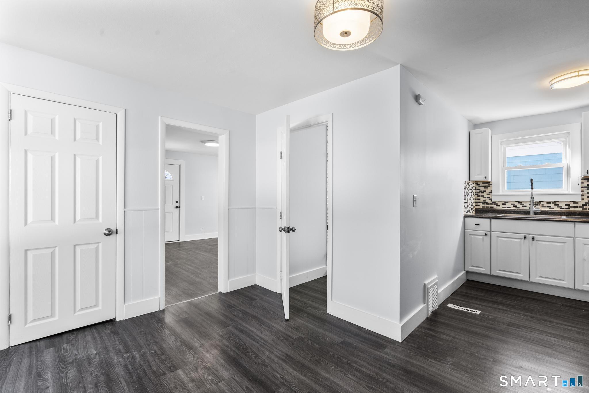 59 Pine Street Hamden, CT 06514 - Photo 6 of 36 a view of a kitchen with wooden floor