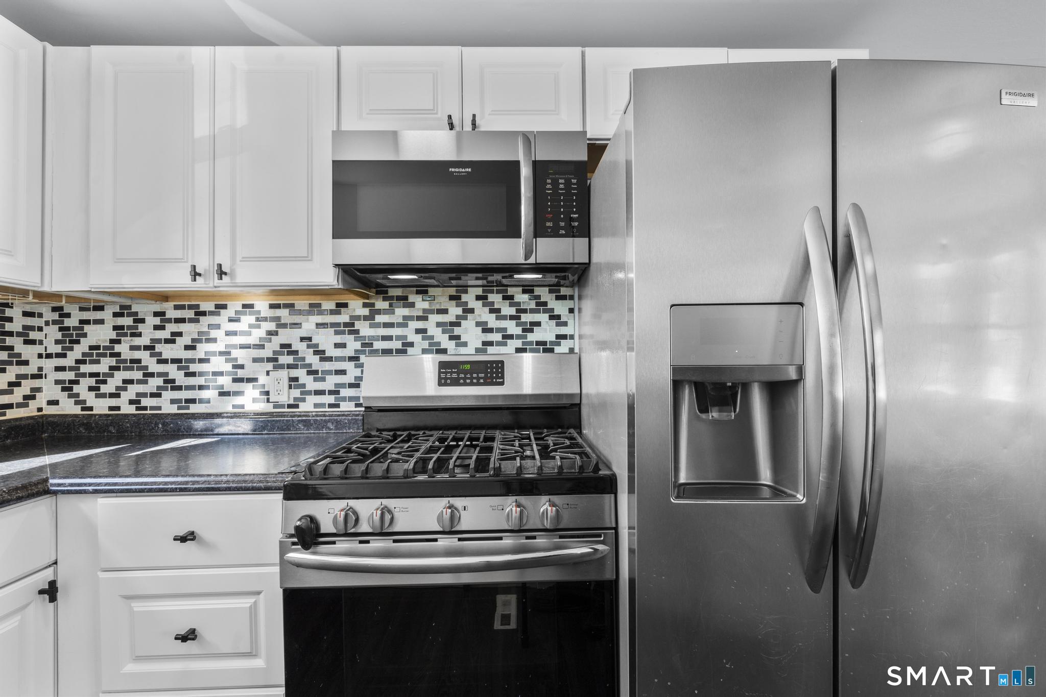 59 Pine Street Hamden, CT 06514 - Photo 10 of 36 a kitchen with appliances and cabinets