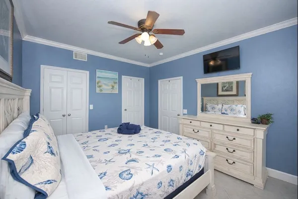 a bedroom with a bed and a dresser