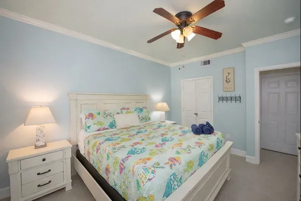 a bedroom with a bed and a lamp