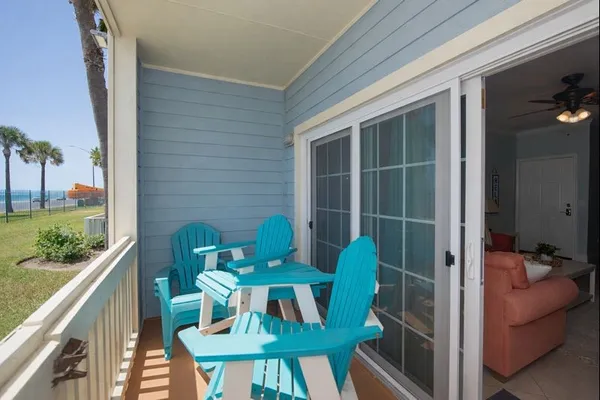 a view of balcony with furniture