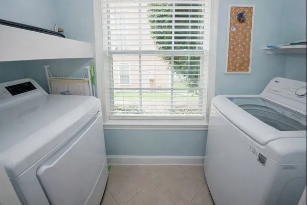 a utility room with dryer and washer
