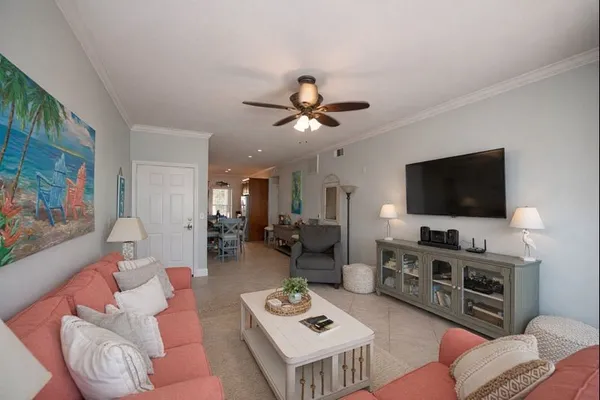 a living room with furniture and a flat screen tv