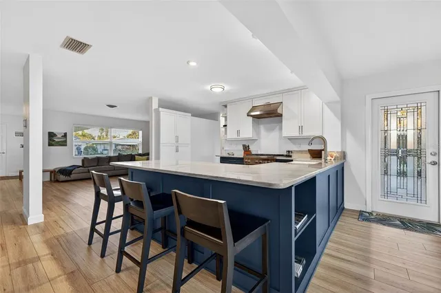 a view of a livingroom with furniture window and wooden floor