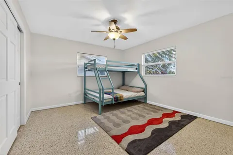a view of a room with furniture and a window