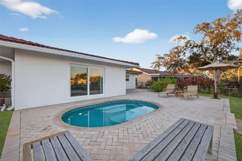 a view of a swimming pool with a lounge chairs