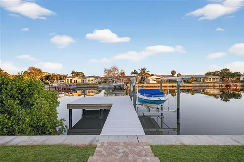 a swimming pool with outdoor seating and yard