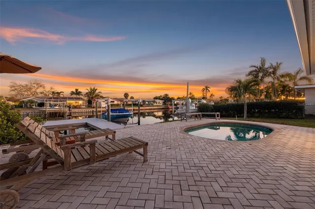 a view of a swimming pool with a patio