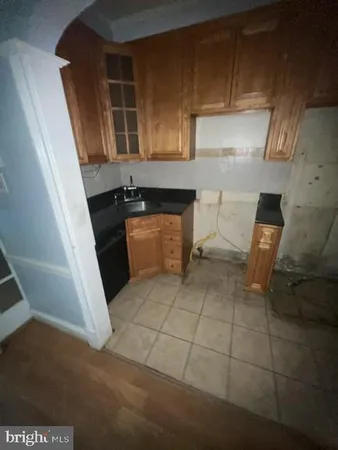 a kitchen with a stove and a microwave