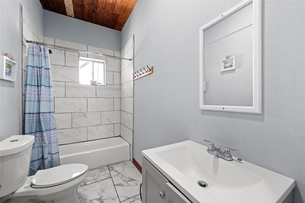 2805 Parrott Avenue Waco, TX 76707 - Photo 16 of 19 Full bathroom with shower / bath combination with curtain, vanity, light marble finish floors, and wooden ceiling
