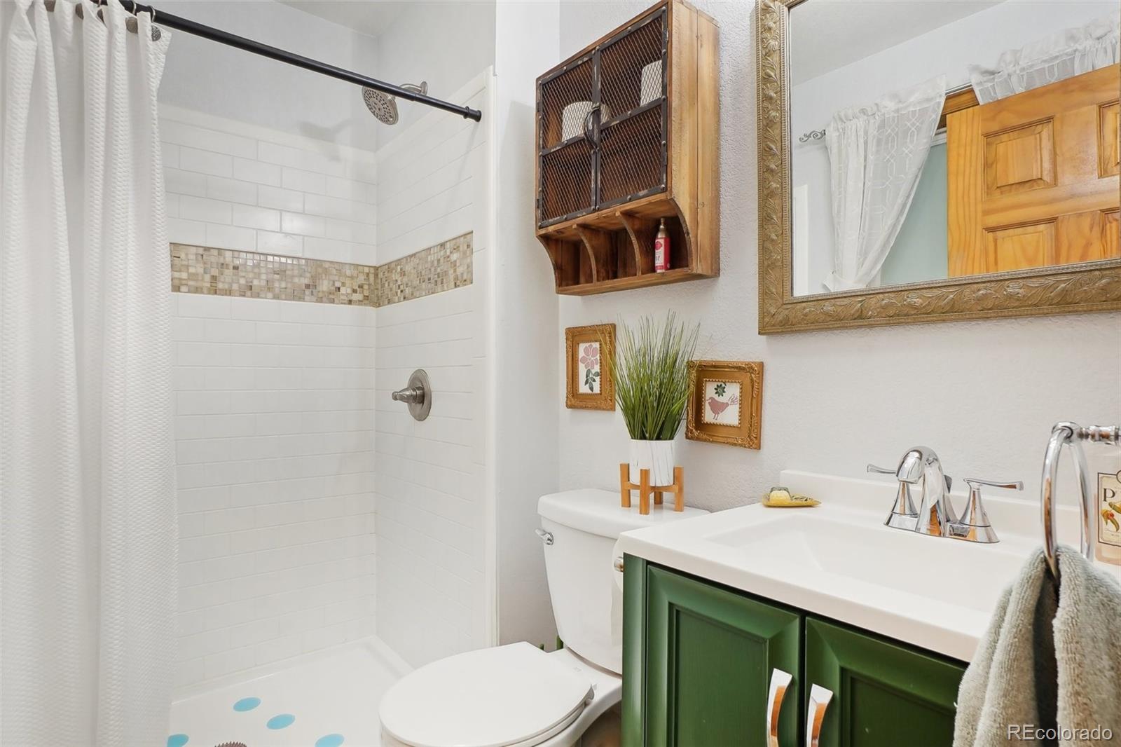 125 Aspen Road Black Hawk, CO 80422 - Photo 14 of 44 a bathroom with a sink toilet and shower
