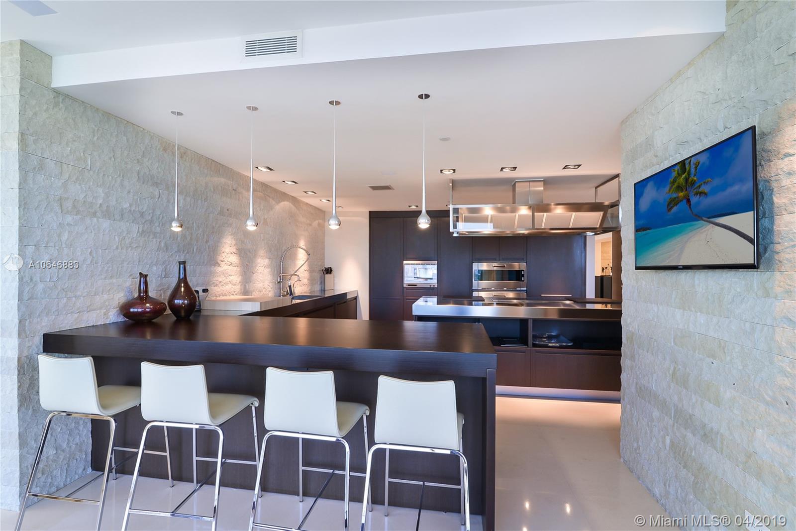 21200 Point Place Aventura, FL 33180 - Photo 14 of 35 CUSTOM DESIGNED BOFFI KITCHEN WITH DOUBLE OVEN, DOUBLE DISHWASHER, GENEROUS STORAGE SPACE, GAGGNEAU AND SUB-ZERO APPLIANCES