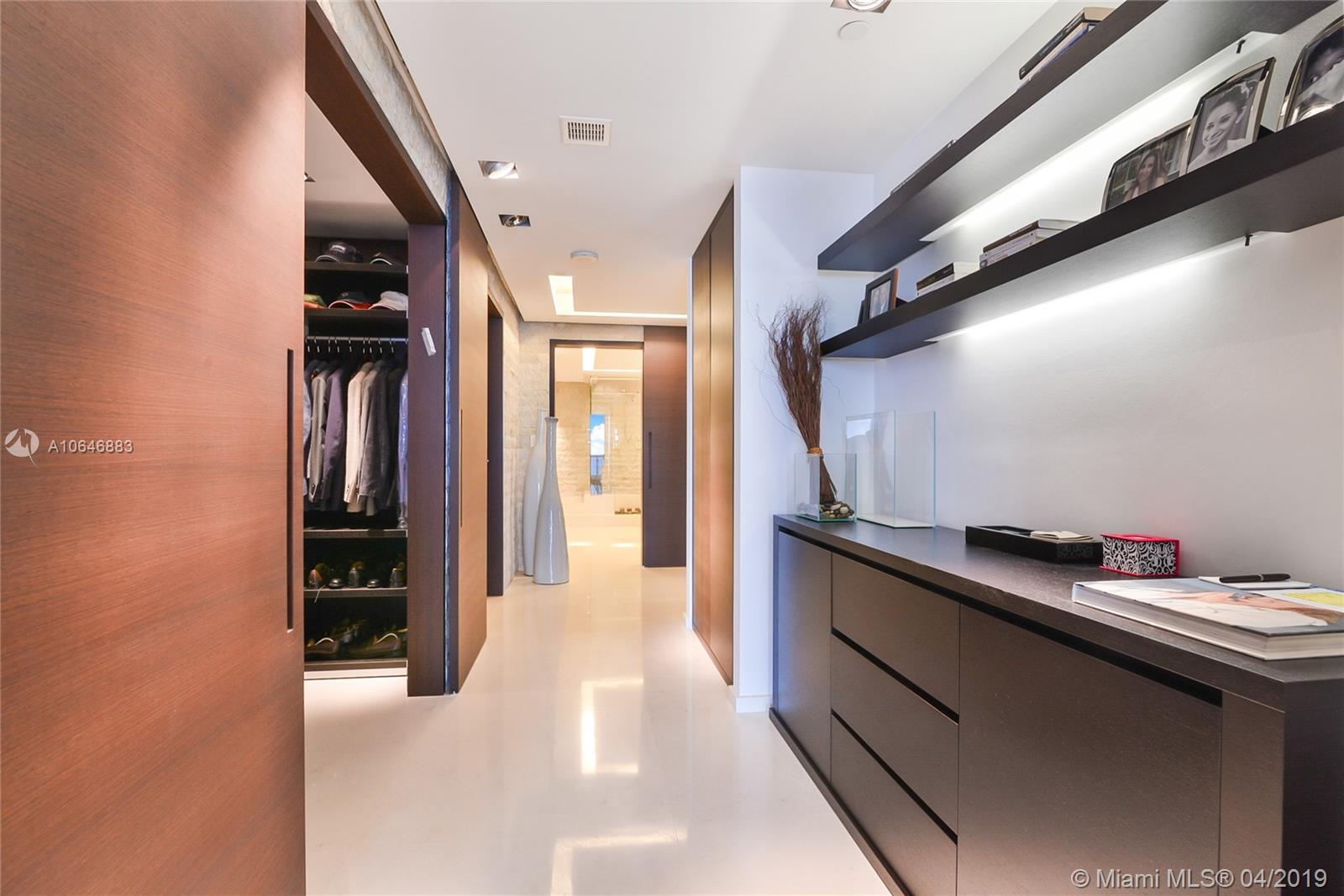 21200 Point Place Aventura, FL 33180 - Photo 24 of 35 MASTER BEDROOM FOYER WITH BUILT INS AND CUSTOM ITALIAN DOORS