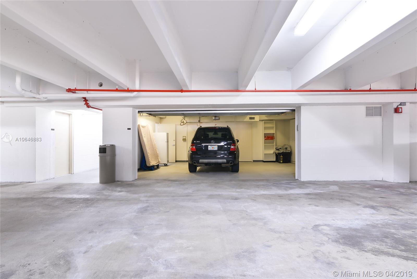 21200 Point Place Aventura, FL 33180 - Photo 35 of 35 PRIVATE 2 CAR GARAGE WITH GATE AND STORAGE - PERFECT FOR YOU COLLECTION CARS, AND UNIT COMES WITH AN ADDITIONAL PARKING SPACE