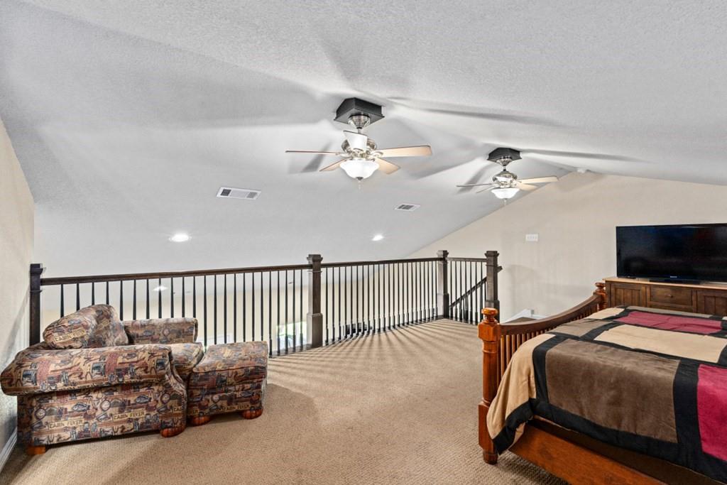 455 County Road 2808 Mabank, TX 75147 - Photo 20 of 40 a bedroom with bed and a tv