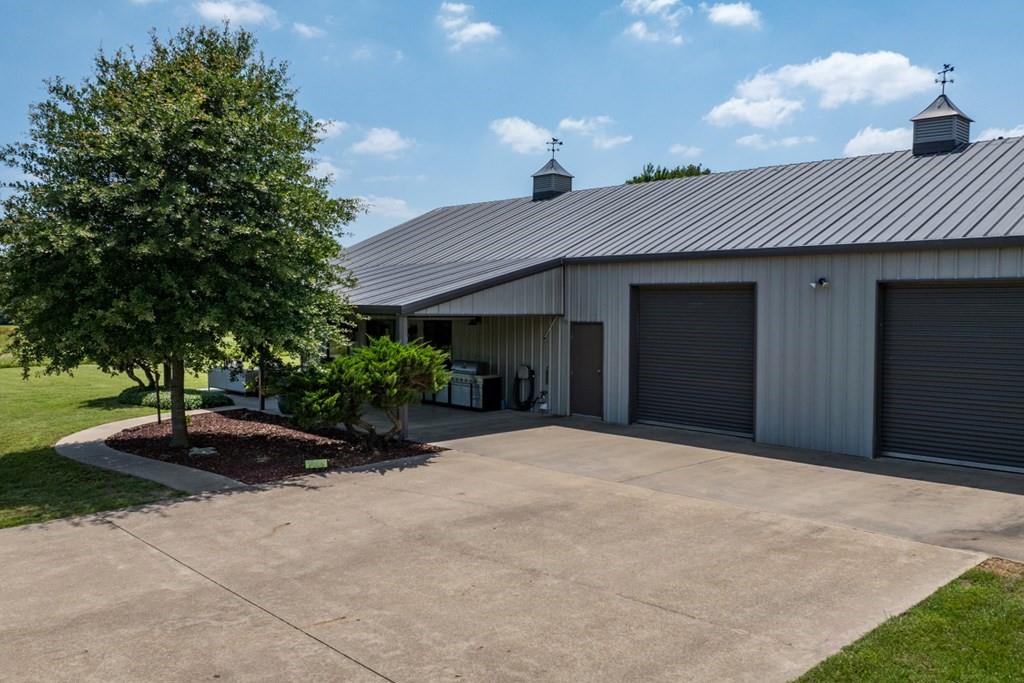 455 County Road 2808 Mabank, TX 75147 - Photo 36 of 40 a front view of a house with a yard and garage