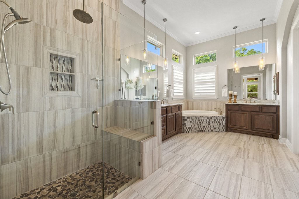108 Berry Cove Georgetown, TX 78628 - Photo 18 of 39 a bathroom with a tub sink shower and windows