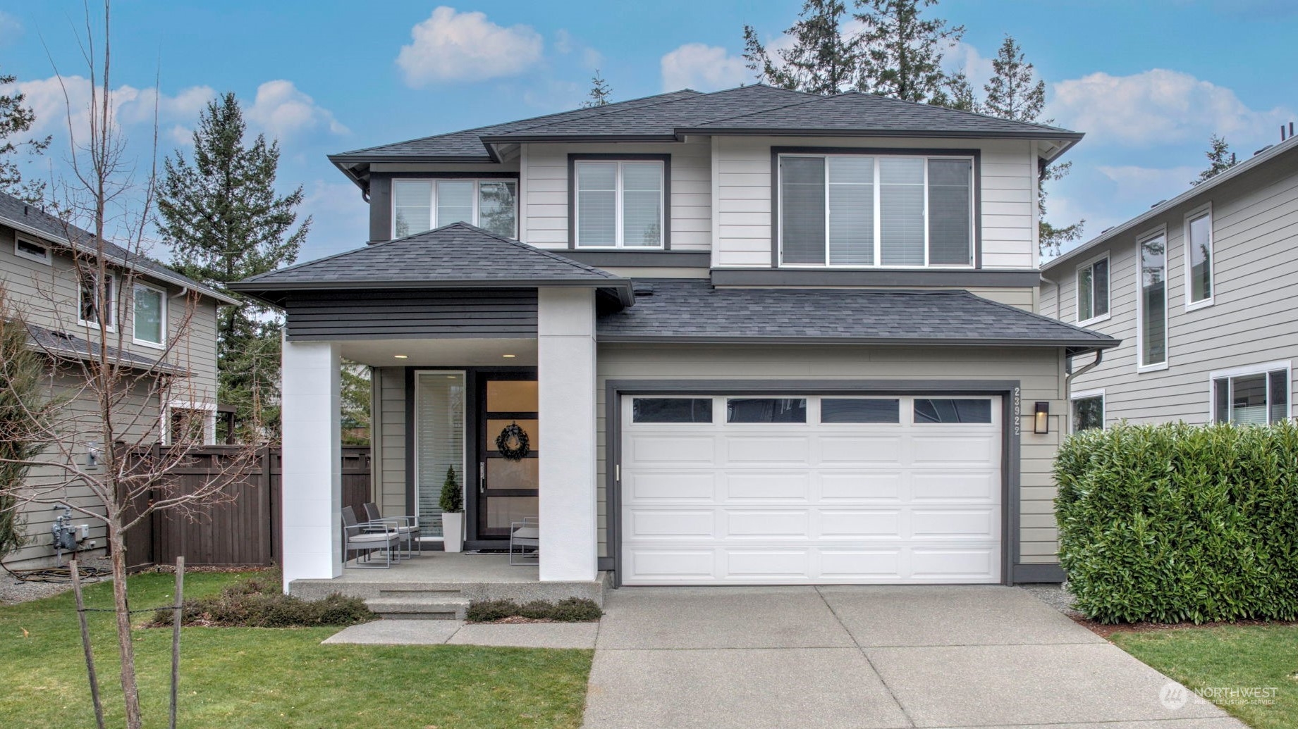 23922 Southeast 258th Way Maple Valley, WA 98038 - Photo 1 of 30 a front view of a house with garden