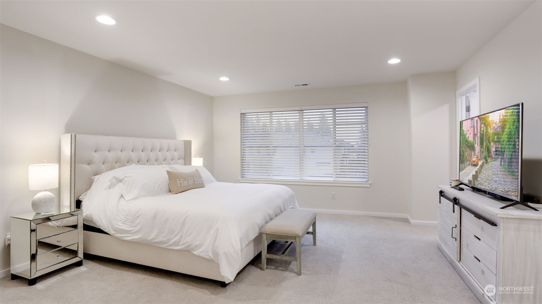 23922 Southeast 258th Way Maple Valley, WA 98038 - Photo 13 of 30 a bedroom with a bed and a flat screen tv