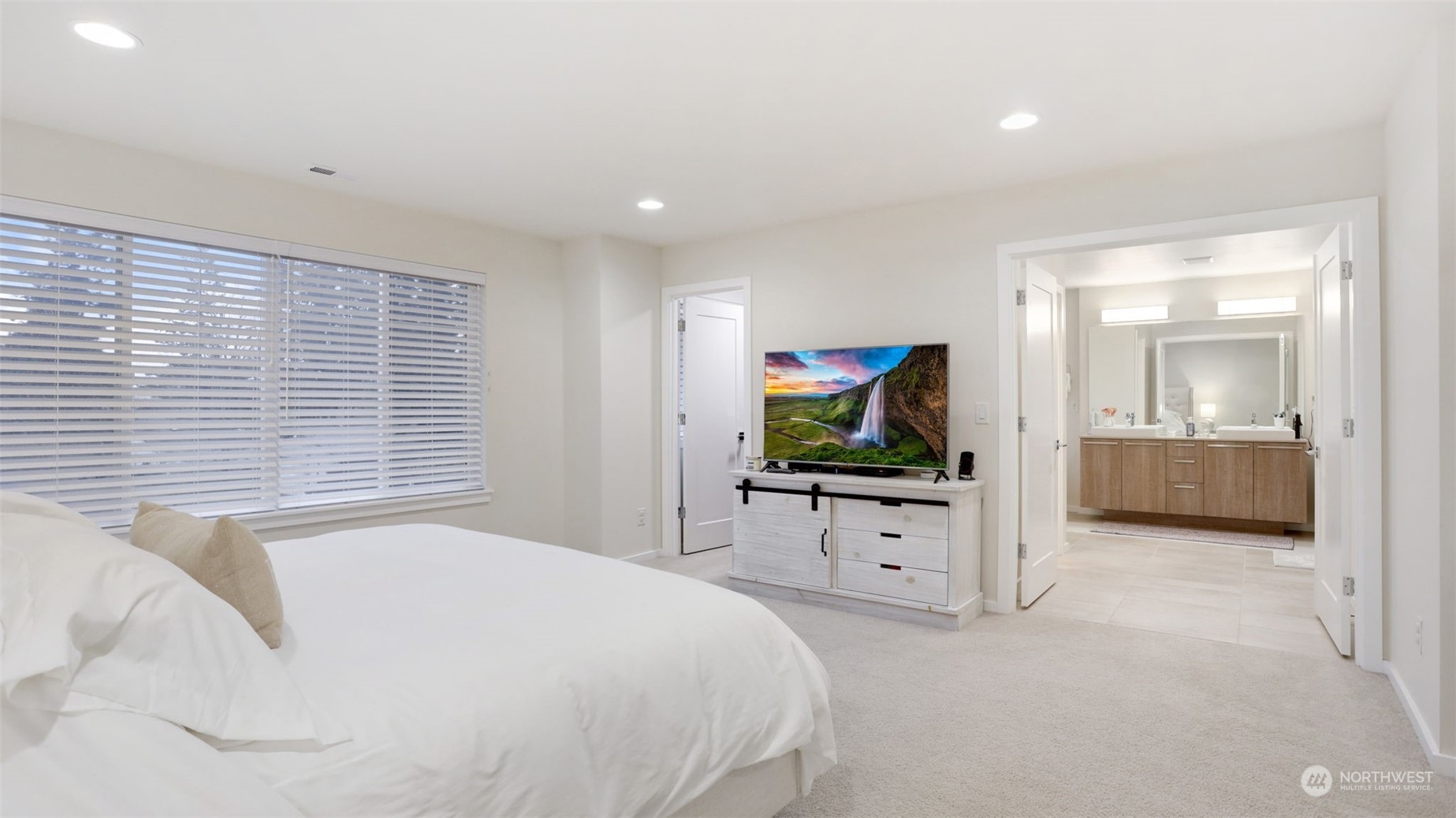 23922 Southeast 258th Way Maple Valley, WA 98038 - Photo 15 of 30 a bedroom with a bed and a television