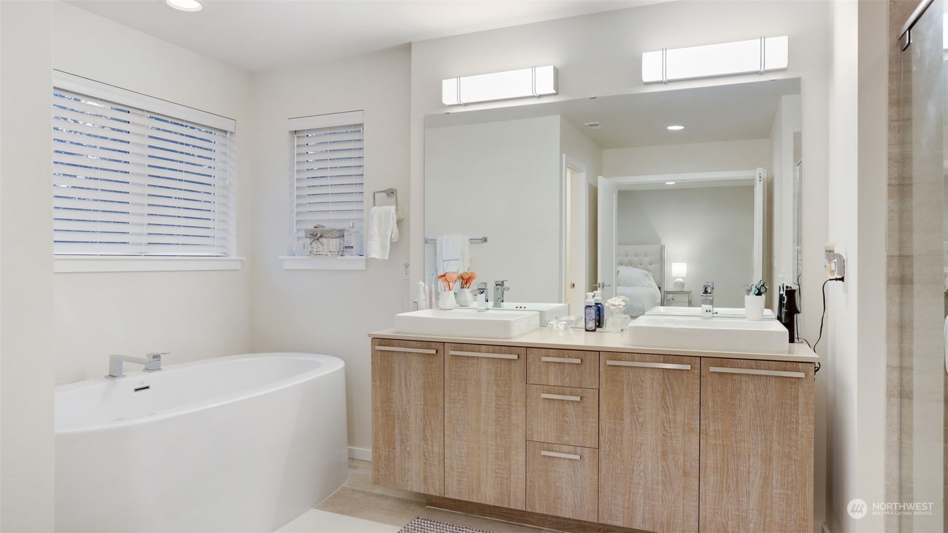 23922 Southeast 258th Way Maple Valley, WA 98038 - Photo 17 of 30 a bathroom with 2 sink tub double vanity and mirror