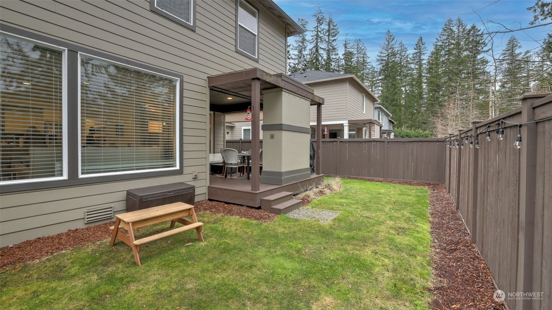 23922 Southeast 258th Way Maple Valley, WA 98038 - Photo 25 of 30 a white bench sitting in front of a house