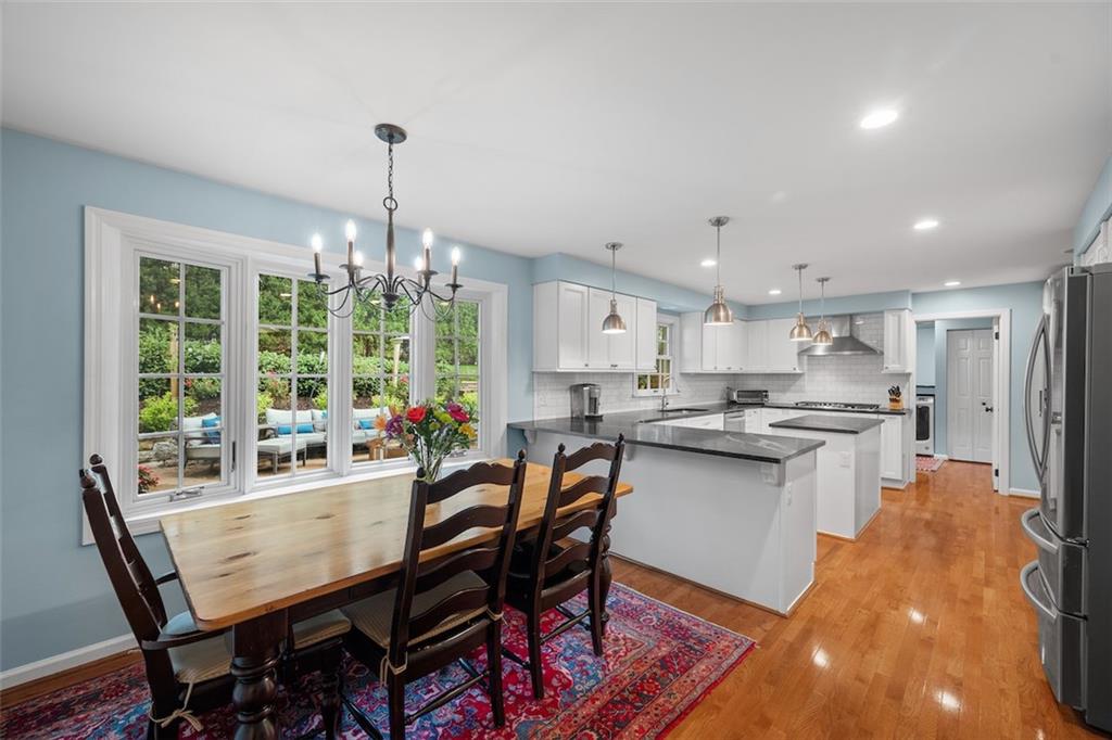 1014 Osage Road Pittsburgh, PA 15243 - Photo 16 of 49 a kitchen with a dining table chairs stove and kitchen view