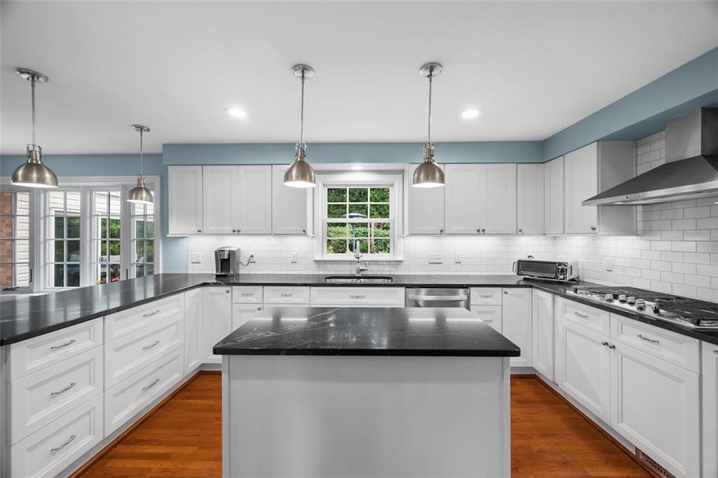 1014 Osage Road Pittsburgh, PA 15243 - Photo 18 of 49 a kitchen with stainless steel appliances granite countertop sink stove top oven and cabinets