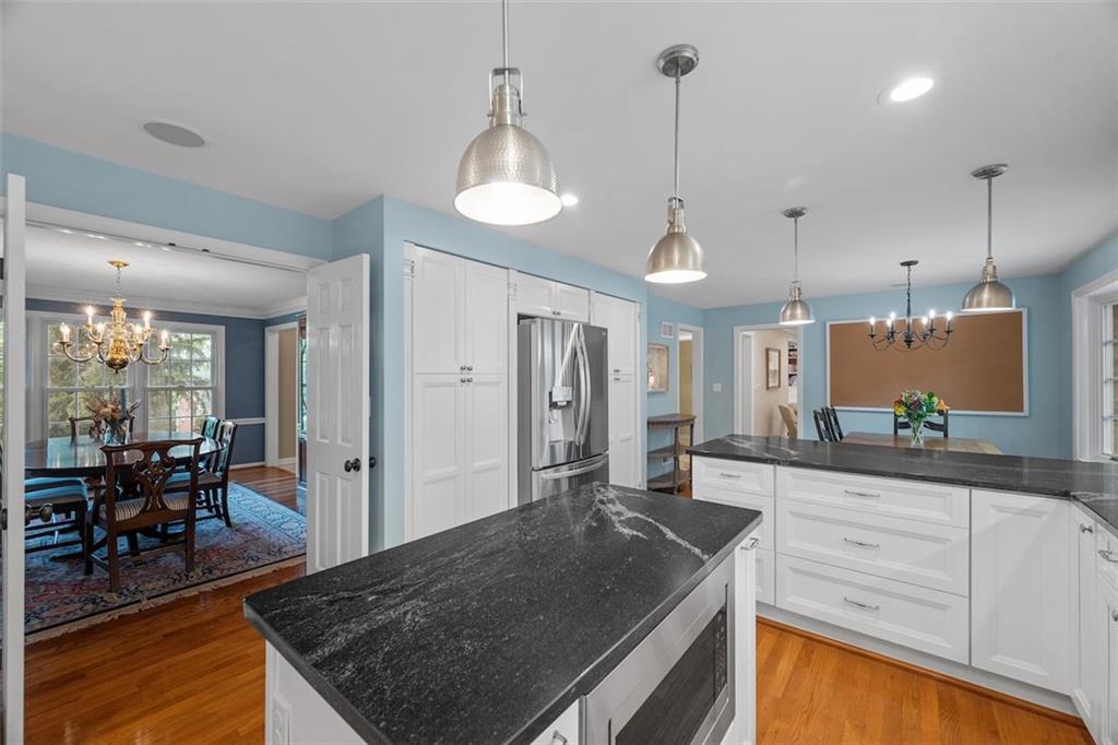 1014 Osage Road Pittsburgh, PA 15243 - Photo 20 of 49 a kitchen with stainless steel appliances granite countertop a stove a sink and a wooden floors