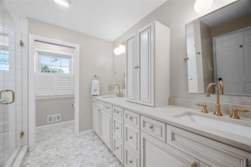 1014 Osage Road Pittsburgh, PA 15243 - Photo 27 of 49 a bathroom with a double vanity sink and a mirror