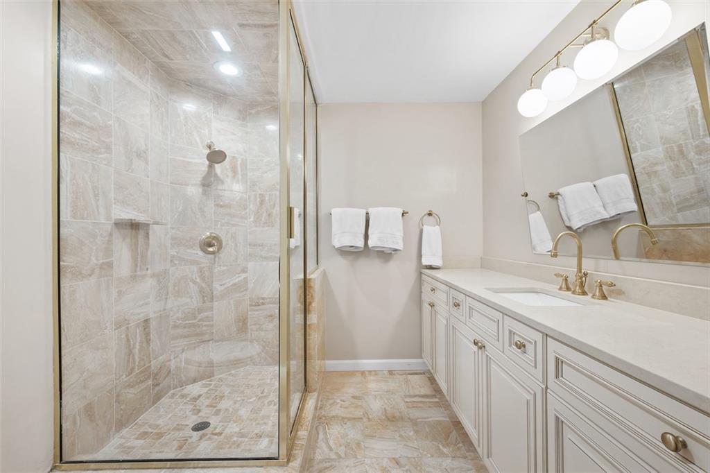1014 Osage Road Pittsburgh, PA 15243 - Photo 31 of 49 a bathroom with a double vanity sink mirror and shower