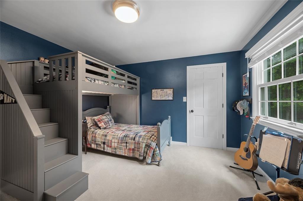 1014 Osage Road Pittsburgh, PA 15243 - Photo 33 of 49 a bedroom with a bed and a chair