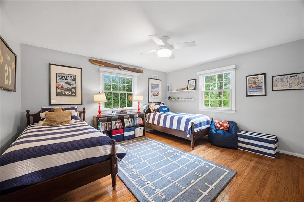 1014 Osage Road Pittsburgh, PA 15243 - Photo 35 of 49 a bedroom with a bed and wooden floor